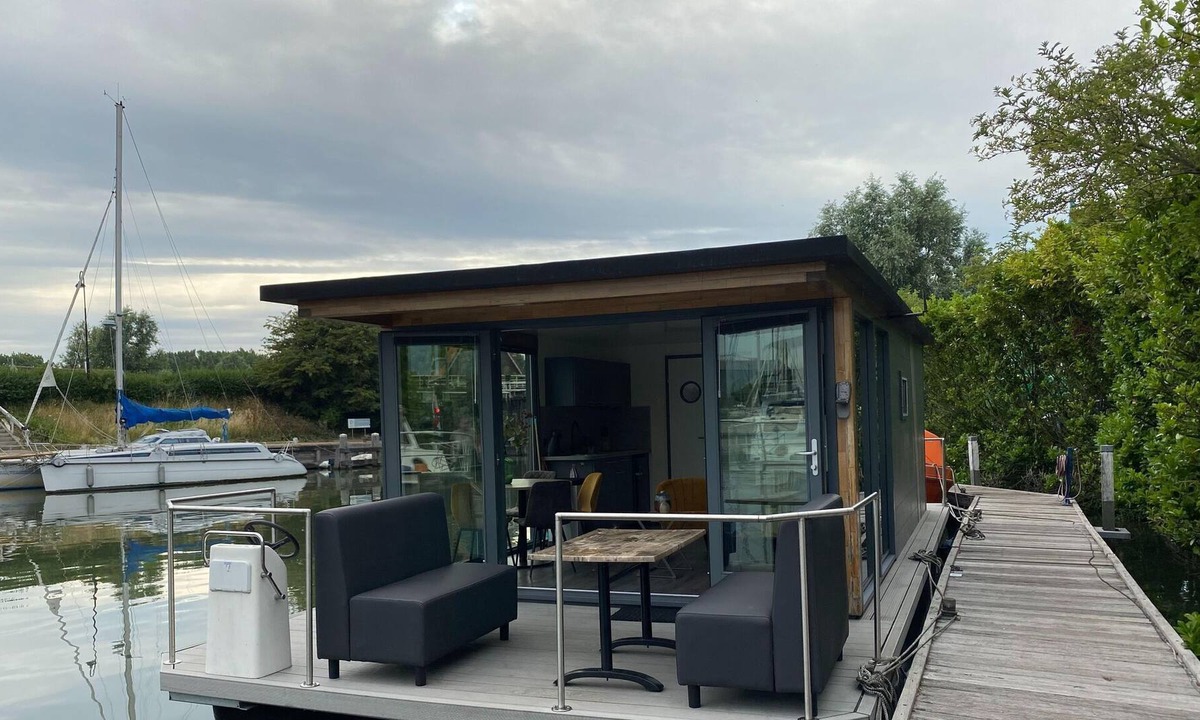 Monnickendam Boat Rental | Modern house boat in Monnickendam with jetty