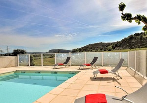 A semi-detached house attached to a farmhouse and opening onto a beautiful 1st floor terrace, with l