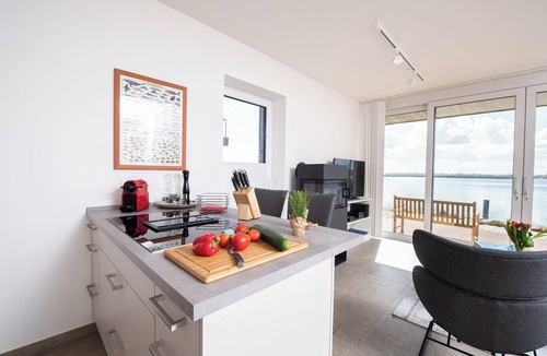Sieseby Apartment | Dock 76 Main - front row, large terrace, sea view, close to the beach, e-charging station
