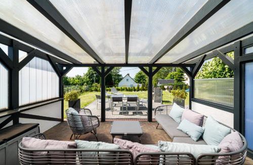 Zirkow Apartment | Ferienhaus Landlust - Erholung mit Fasssauna und Whirlpool nahe Binz!