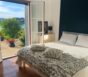 Bilieu House | L'EMERAUDE suite lake view swimming pool beach 10 min walk away