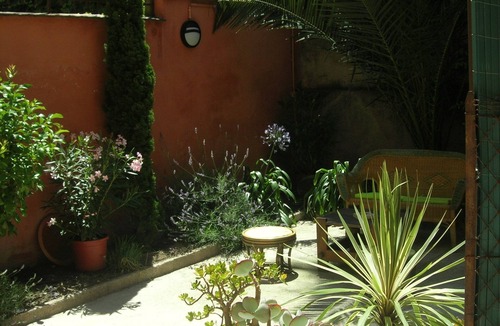 Les Remparts Apartment | Large T2 of character, downtown with garden/patio.