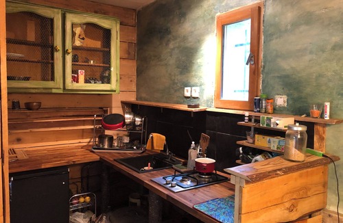 Rennes-les-Bains Apartment | Like a cabin, between forest and river, with a terrace facing the garden.