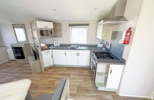 Bleadon House | Modern and contemporary 12ft-wide caravan with one double and two twin.