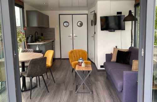 Monnickendam Boat Rental | Modern house boat in Monnickendam with jetty