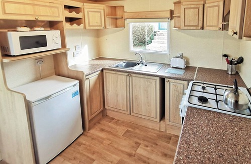 Aberystwyth House | Spacious 12ft-wide caravan with one double and one twin.