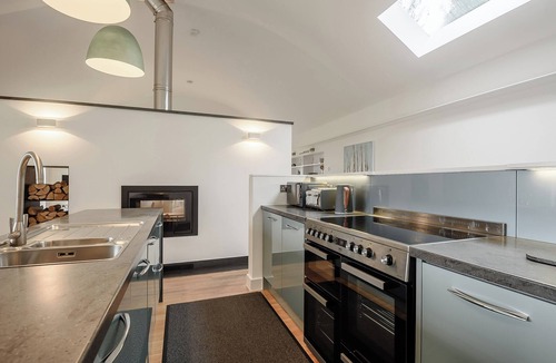 Arthog Cottage | This striking home is ideally located between the beach and the hills.