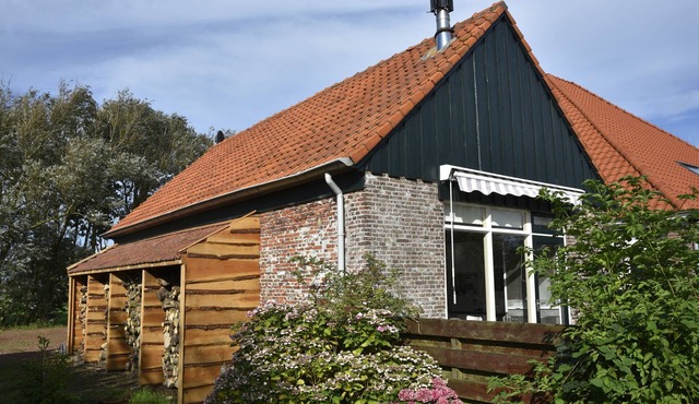 Beautiful authentic cottage in the middle of nature on farmyard with beautiful orchard