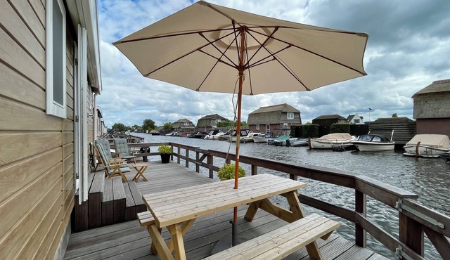 Comfortable holiday home for 4 guests with a waterfront terrace, private swimming ladder, and private mooring dock.