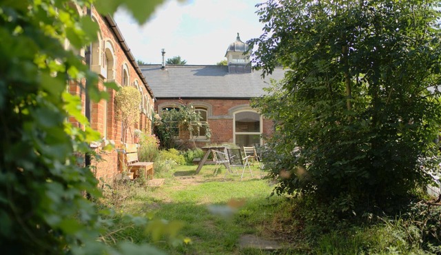 Converted stable block cottage with function room, courtyard garden & woodland