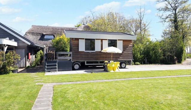 Tiny House Koolmees is a cosy accommodation for two on a peaceful campsite in Oudesluis. Enjoy the wide North Holland countryside and explore nearby beaches, dunes and charming towns such as Callantsoog and Schagen.