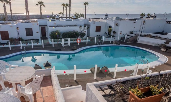 Playa Blanca Apartment | Apartment "Puerto Chico 7" with Sea View, Shared Pool, Terrace & Wi-Fi