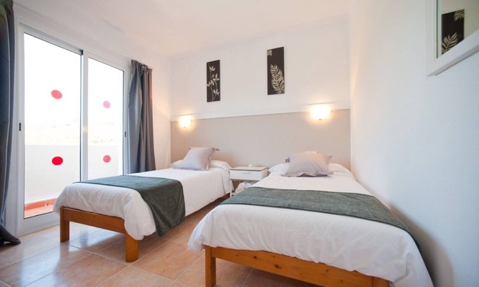 Santa Eulalia del Rio Apartment | Apartment Ses Veles 2 dormitorios close to the Beach with Sea View, Pool, Wi-Fi & Garden