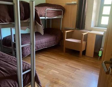 Single Bed in Dormitory Room